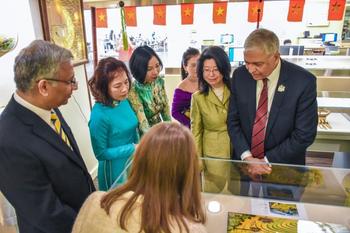Attendees toured the Viet Nam exhibit in Mason's Special Collections and Archives. Photo by Jeffrey Porovich/Costello College of Business
